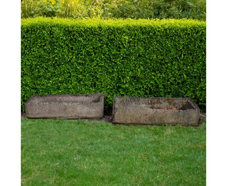 A ROUGHLY HEWN RECTANGULAR STONE TROUGH (2)100cm wide; 46cm deep; 20cm high, and another similar, 97cm wide; 46cm deep; 20cm 