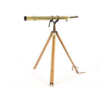 AN EARLY 20TH CENTURY BROADHURST BRASS REFRACTOR TELESCOPEwith folding oak tripod, 113cm long