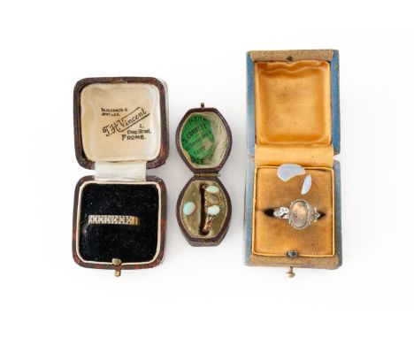 AN 18CT GOLD AND DIAMOND SEVEN STONE HALF HOOP RING AND TWO FURTHER RINGS (3)The diamond ring claw set with a row of small si