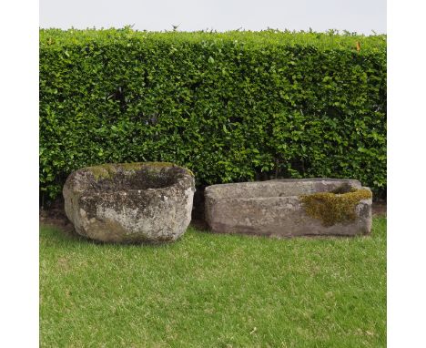 A SMALL CARVED RECTANGULAR LIMESTONE TROUGH (2)96cm wide; 38cm deep; 16cm high and an oval reconstituted stone trough, 62cm w