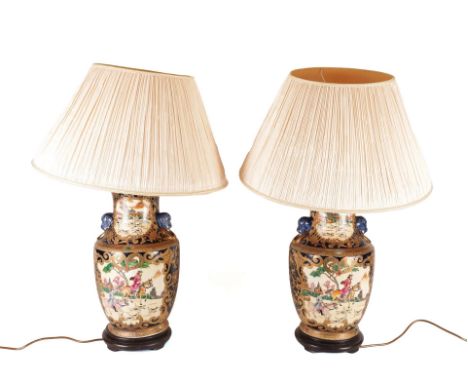 A PAIR OF GILT DECORATED CERAMIC VASE TABLE LAMPS (2)20th Century 
Of baluster form with foo dog masks, decorated with huntin