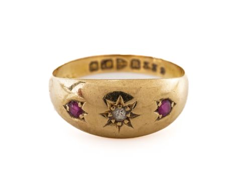 A RUBY AND DIAMOND THREE STONE RINGWith gypsy set round cut stones, in 18ct, gross weight 2.37 grams
