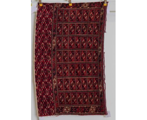 A TEKKE TURKMAN JUVALThe field made up of seven columns of seven compartments each bearing a gul, minor border with a serrate