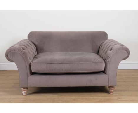A MODERN GREY UPHOLSTERED SOFAWith roll over button upholstered arms,170cm wide; 80cm high