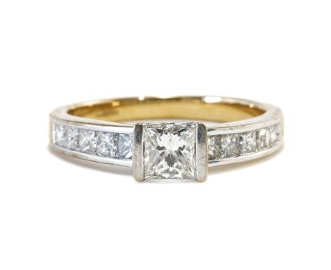 AN 18CT GOLD AND DIAMOND RINGMounted with the principal princess cut diamond at the centre, between princess cut diamond five