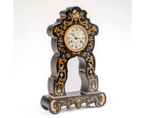 A NAPOLEON III EBONISED, CUT-BRASS AND IVORY-INLAID MANTEL CLOCKThe clock of shaped outline, decorated all over with birds, f