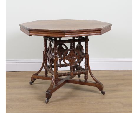 AN ARTS & CRAFTS MAHOGANY OCTAGONAL CENTRE TABLEOn ring turned supports, 90cm wide; 71cm high
