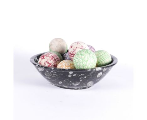A FOSSIL MARBLE TABLE BOWL TOGETHER WITH TEN SCOTTISH POTTERY CARPET BOWLS (11)The bowl, 30cm wide; 9cm high