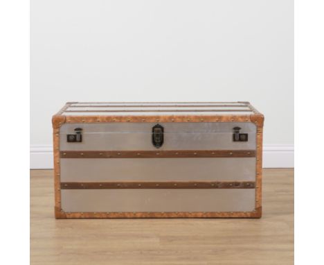 A MODERN LEATHER BOUND BRUSHED STEEL STEAMER TRUNK101cm wide; 51cm deep; 51cm high