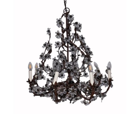 A WROUGHT-IRON EIGHT LIGHT CHANDELIERModern
Of naturalistic form with faceted glass drop flower petals 70cm wide; 100cm high