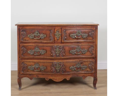 AN 18TH CENTURY FRENCH WALNUT SERPENTINE THREE DRAWER COMMODEWith shell carved decorated drawer fronts, 121cm wide; 61cm deep