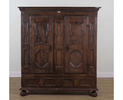 A 17TH CENTURY AND LATER OAK HANGING CUPBOARDWith pair of geometric moulded panel doors, 166cm wide; 51cm deep; 185cm highThe