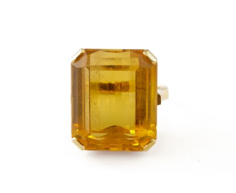 A GOLD AND CITRINE SINGLE STONE RINGClaw set with a cut cornered rectangular step cut citrine, detailed 18 CT, ring size K, g