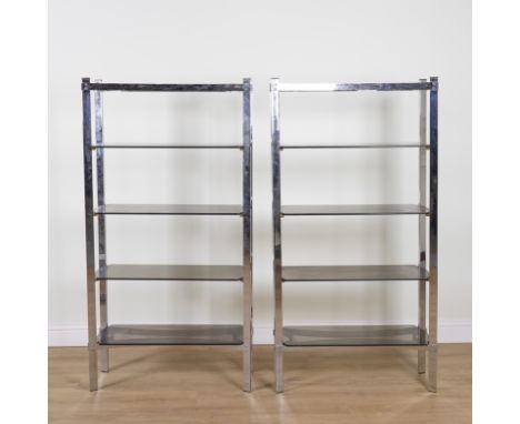 A PAIR OF CHROME AND GLASS FOUR TIER OPEN BOOKCASES (2)91cm wide; 31cm deep; 176cm highGood overall condition minor marks and