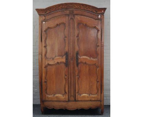 AN 18TH CENTURY FRENCH FRUITWOOD TWO DOOR ARMOIRE130cm wide; 57cm deep; 215cm highOld marks and scratches present throughout,