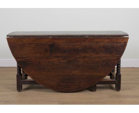 A 17TH CENTURY OAK GATE LEG TABLEOn turned supports, 50cm wide; 183cm wide open; 151cm long; 75cm highMade up construction wi