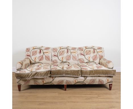 GEORGE SMITH; A FLORAL UPHOLSTERED THREE SEAT SOFAOn tapering square supports, 216cm wide; 83cm highUpholstery is fairly worn