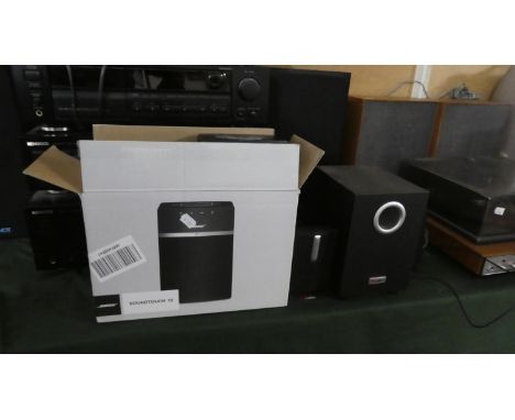 A Bose Soundtouch Wireless Speaker and a Labtec Multimedia Speaker System 