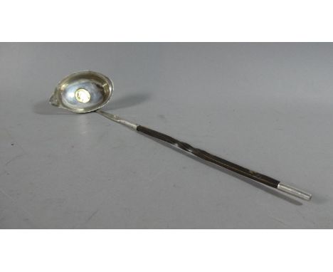 A Georgian White Metal Toddy Ladle with Baleen Handle 