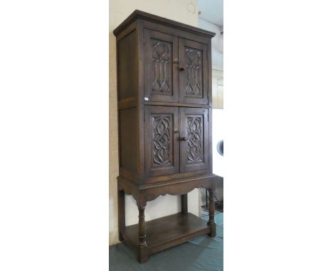 A Carved Oak Side Cabinet with Panelled Doors, Stretcher Shelf, 62cm Wide