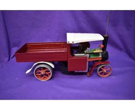 A Mamod Live Steam Wagon SW1 having traditional green and black engine with repainted burgundy body