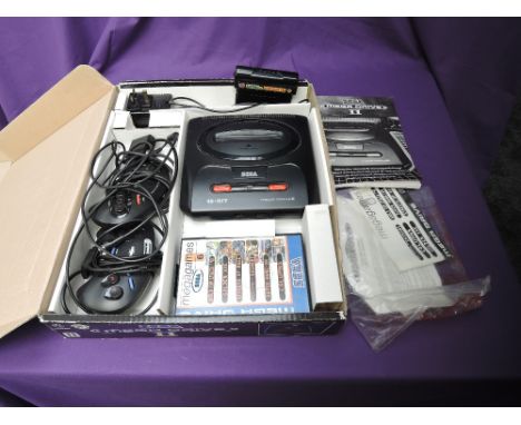 A Sega Mega Drive II 16-Bit Games Console with Sonic &amp; Knuckles and Mega Games 6 games cartridges, with two controllers, 