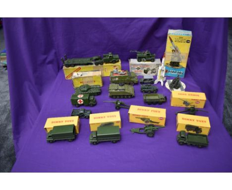 A selection of Dinky Military playworn vehicles and accessories including Recovery Tractor, boxed 661, Centurion Tank, boxed 