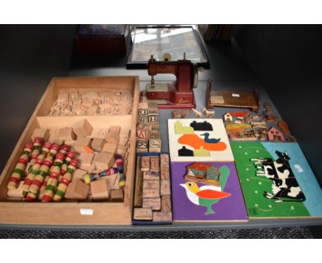 A selection of vintage toys and puzzles including a Vulcan Senior Sewing Machine, Galt Toys wooden Cow Puzzle, similar wooden