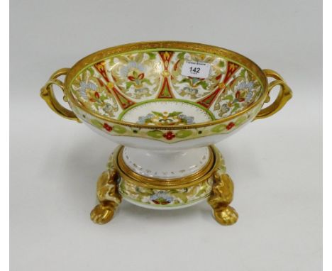 Noritake twin handled bowl with gilt handles and borders and painted floral panels, complete with a circular stand on three p