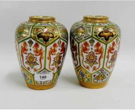 Pair of Noritake high shouldered baluster vases with dragon pattern panels and gilt edged rims, printed backstamps, 16cm high