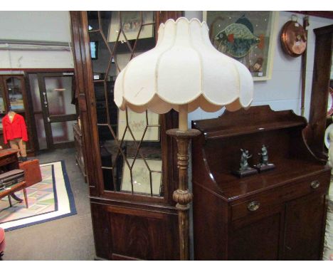 A gilded standard lamp with shade 
