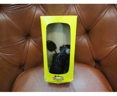 A boxed Pelham black poodle puppet