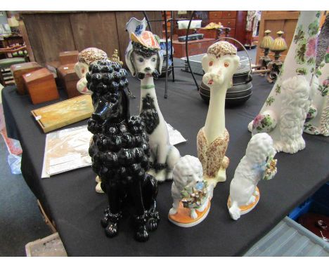 Six ceramic poodle figures 