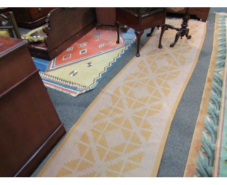 A deep yellow Kilim runner with geometric pattern, 333cm x 71cm