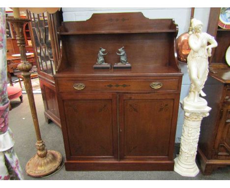 A Regency style mahogany chiffonier with raised shelf back and holly inlaid decoration the single drawer over a two door cupb