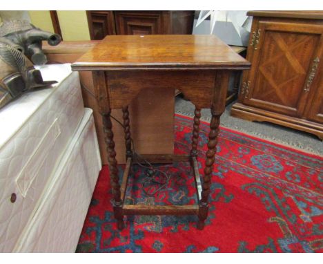 An oak lamp table with barley twist legs, 72cm x 46cm x 45cm