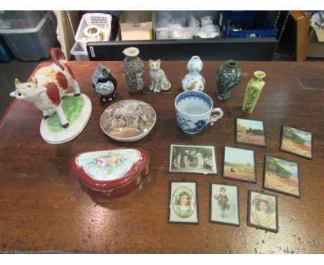 A box containing assorted items including a 19th Century cow creamer, a porcelain patch box, miniature vases and paintings 