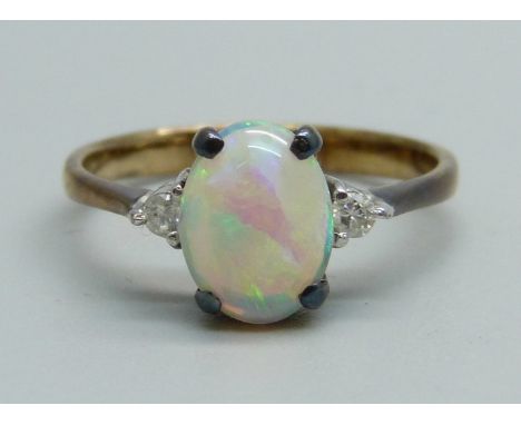 A 14ct gold and opal set ring, with two small diamonds, 2.3g, N 