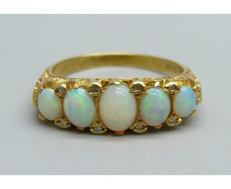 An 18ct gold and five stone opal ring, 5.2g, P 