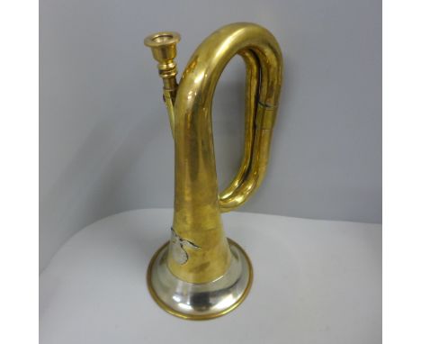 A bugle with later applied German badge 