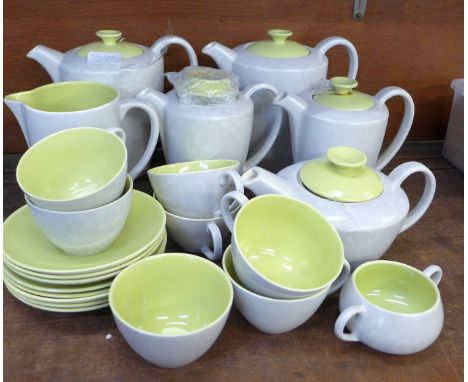 Poole pottery tea wares, five tea and coffee pots, cups and saucers, etc., one lid a/f 