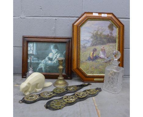 A Northern Pottery Canada figure, horse brasses, a candlestick, a glass decanter, a glass bell and two pictures including one