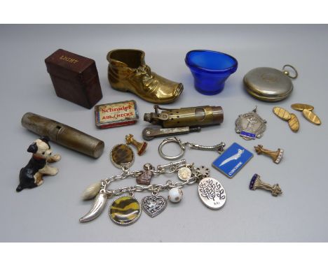 Assorted items including a lighter, a vesta case in the form of a pocket watch case, a silver dancing fob, a brass match stri