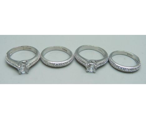 Four silver dress rings, marked S925, unused, 2x K, 2x L 