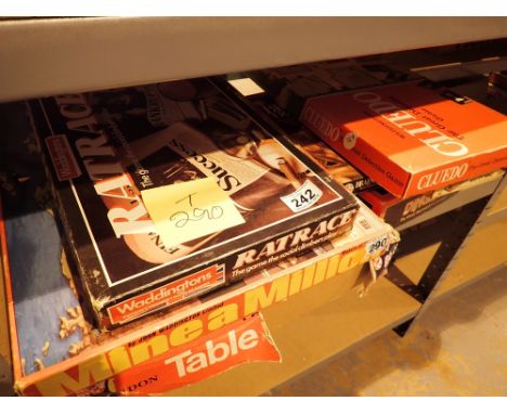 Shelf of vintage boxed childrens board games