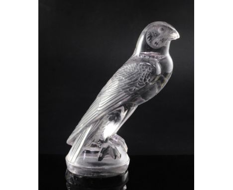 Faucon/Falcon. A glass mascot by René Lalique, introduced on 26/8/1925, No.1124 with a strong amethyst tint, signed R.LALIQUE