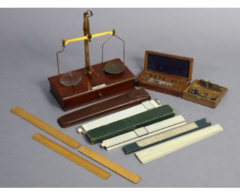 A mahogany brass beam scale to weigh 202, in a fitted mahogany case; together with a sovereign scale; two sets of weights; &a