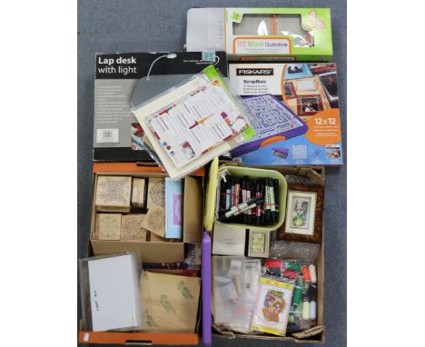 A Fisker’s “Scrapboss” embossing system; a lap-desk with light, a Tonic Maxi guillotine, all boxed, and a large quantity of v
