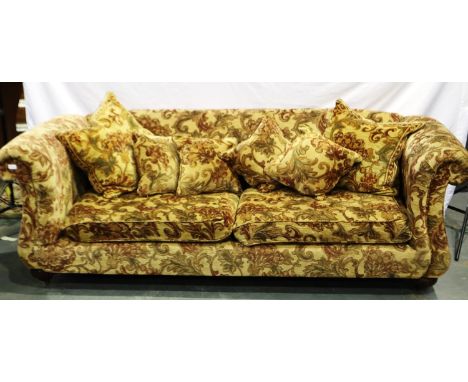 A 20th century upholstered sofa, in red brocade against a gold ground with scatter cushions, L: 235 cm. Not available for in-