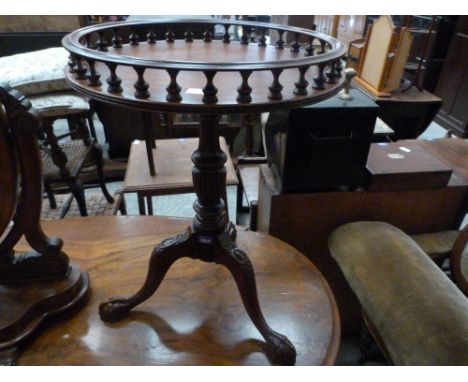 A wooden mahogany tripod table of recent manufacture with galleried top. 19'' diameter